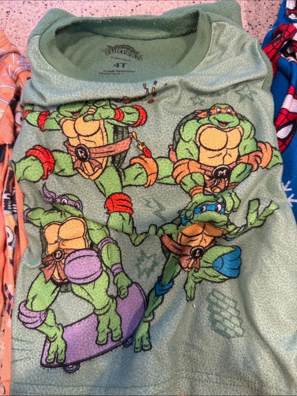 4 sets of kids pjs. Loose fitting 4T and snug fit 5T.
